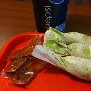 a sandwich and a drink on a tray