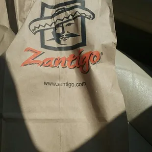 a paper bag with a logo on it