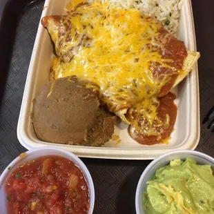 Chicken enchiladas side of salsa and guac