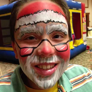 Christmas party face painting of a Santa by Zanypaint Face Painting.