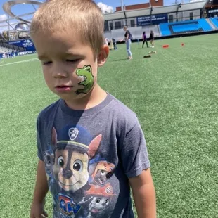 He didn't want a daddy to take a photo but loved his dinosaur.