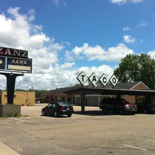 a car parked in front of the restaurant