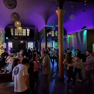 a crowd of people at a bar