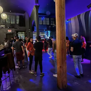 a group of people at a bar