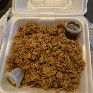 Jollof Rice, There wasn't a lot of flavor in the rice , only 4 shrimp, 3 beef chunks, and 4 dry chicken chunks