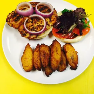 Blackened Tilapia burger with fried plantain.