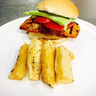 Zanzibar salmon burger with fries cassava.