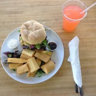 Hand made turkey burger seasoned LIB style with romaine and fried cassava (Yucca).