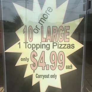 a large pizza sign