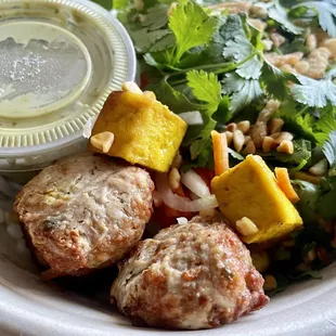 Build Your Own (kind of) with Chicken meatballs with some tofu pieces, carrot, daikon, cilantro etc. with green curry sauce on the side