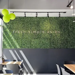 a dining area with tables and chairs