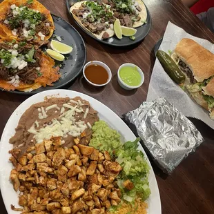 Bottom: Pollo Asada Plate Left: Quesbirria taco Upper left: Carne Asada Taco Upper right: Carne Asada Torta