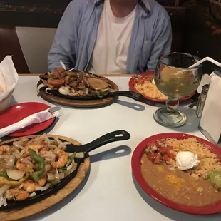 Shrimp fajitas and Steak and Potato fajtas. The amount of the included rice, beans, and salsa and quac are enough for a meal of its own !!