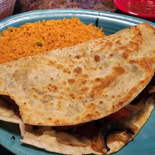 Chicken Fajita Quesadilla ( came with the side looking like someone tore a few bites off)