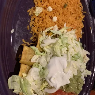Flautas with sour cream  &amp; guac with rice