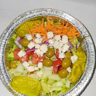 a salad in a foil container