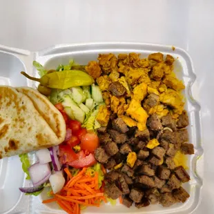 a meal in a styrofoam container