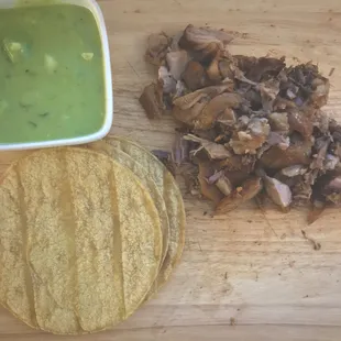 a tortilla and a bowl of guacamole