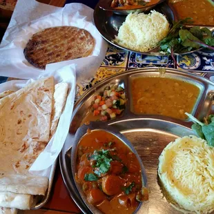 Chicken curry on bottom and chicken tikka masala on top with naan and sheermal for our breads. Not bad