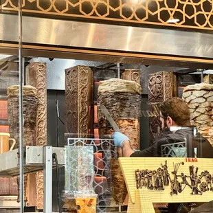 a man standing in front of a window