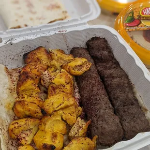 Left: 2 chicken kababs. Right: 2 kubeidehs. Back: baba ghanoush and hummus picked up from the international food bazaar grocery next door.