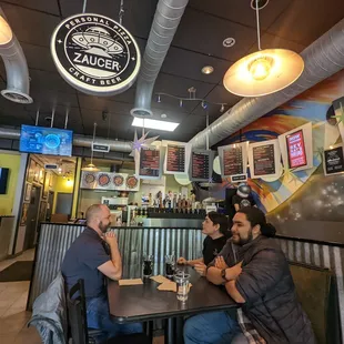 a group of people sitting at a table