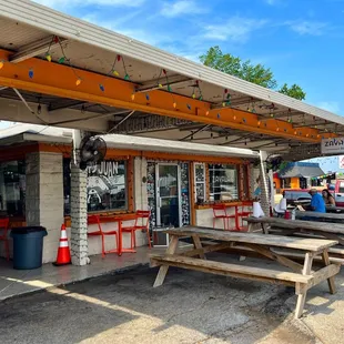 Front door with benches outside to sit and eat.