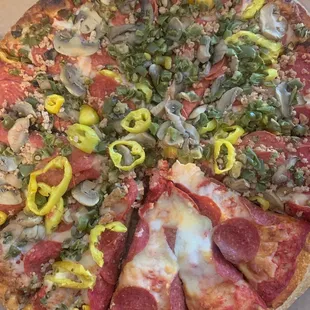 Pepperoni, Green Peppers, sausage mushroom pizza, alongside pepperoni pizza