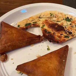 Naan and Samosa Sorry it was to Delicious to leave it sitting there for a picture.