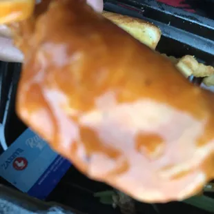 a hand holding a donut