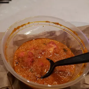 Chicken tikka masala. Oil covering the top layer. Much more oil before I poured some out on my rice to eat.