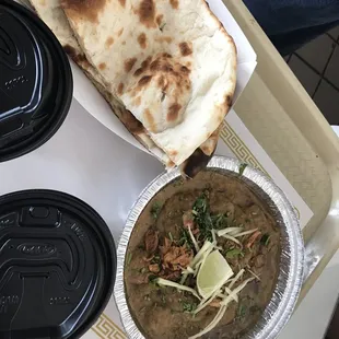 Fresh made Haleem with fluffy naan bread