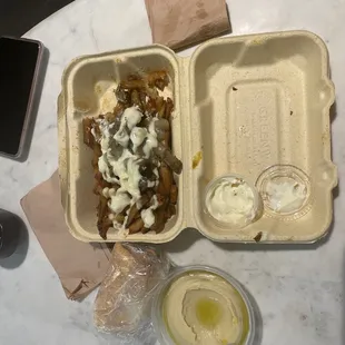 a meal in a styrofoam container