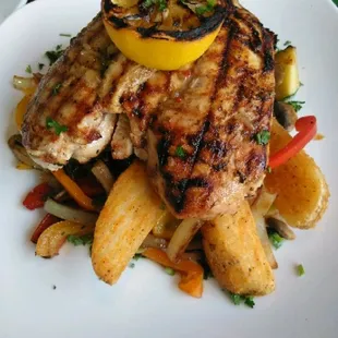 Grilled chicken and veggies Potatoe wedges with a lemon sauce