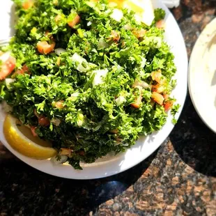 Tabouli and falafel. The fresh pita bread is to die for, and the hummus is so creamy.