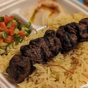 a plate of rice and vegetables