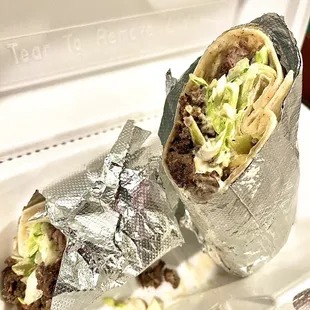 a burrito wrapped in aluminum foil