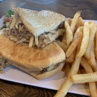 Roast pork sandwich with potato stix and fries