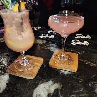 two cocktails on a bar