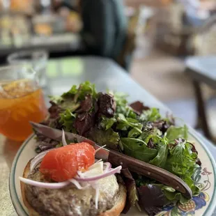 Cheeseburger with mounds of lettuce