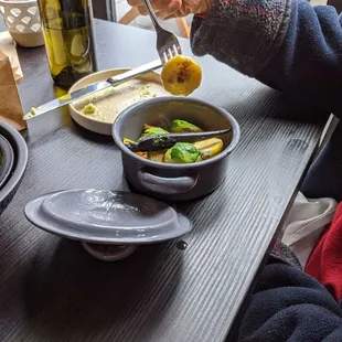 Sauteed vegetables in small pot.  Bright and cooked perfectly.  Some were yellow baby squash.