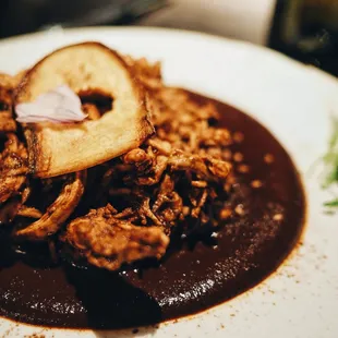 Mole Poblano - chicken breast, homemade mole poblano, red rice | $23