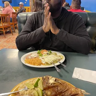 Mojarra Frita and green enchiladas. Boyfriend enjoying live music on Sunday night.