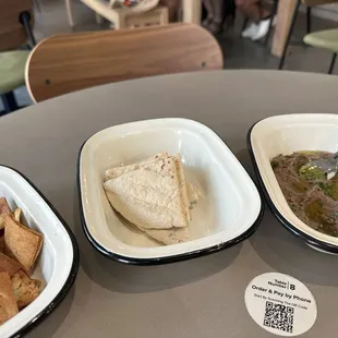 Pita (two types) served with fava bean dip.
