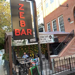people sitting outside a restaurant