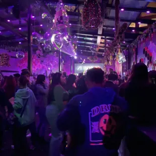 a crowd of people at a party