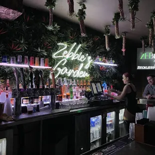 a man and a woman at a bar