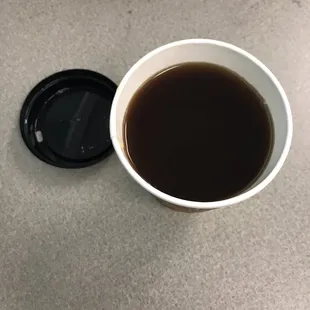 a cup of coffee with a lid