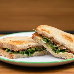 Adult PBJ Sandwich with organic arugula, almond butter, strawberry jam &amp; melted brie cheese