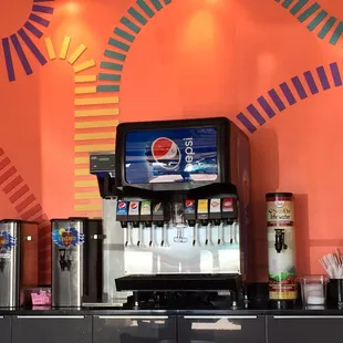 a soda dispenser on a counter